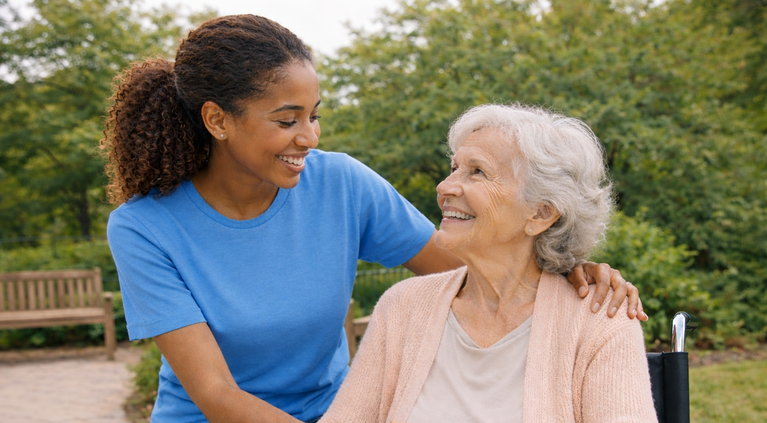 Caregiver with senior woman in wheelchair | senior home care Main Line PA | Neighborly Home Care